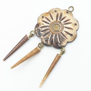 Vintage hand carved bone flower pendant with inlaid metalwork and horn dangles